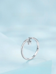 Macro shot of S925 sterling silver ring showing the intricate dog paw print pendant detail