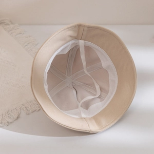 Detailed interior of a beige kids fisherman hat with reinforced seams and windproof cord