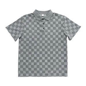 Detailed close-up of grey checkerboard knit fabric and classic three-button polo collar