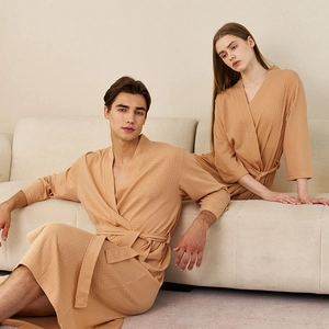Lightweight waffle weave bathrobe in apricot color with waist tie for men and women