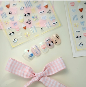 Detail of KX480 cute cartoon puppy and ice cream nail stickers on matte pink backdrop