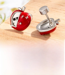 Macro shot of red apple earring studs made of titanium steel with detailed dimensions