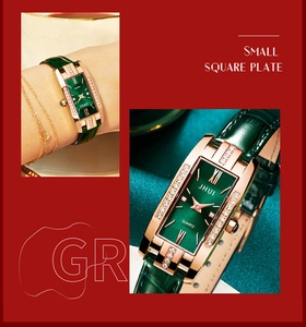 Detail of small square green dial watch with rose gold case and leather strap