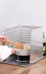 Foldable aluminum foil oil splash guard for kitchen stove during cooking detail