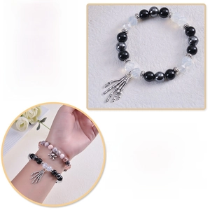 Detail of gothic natural stone bracelets with skulls and comfortable elastic design