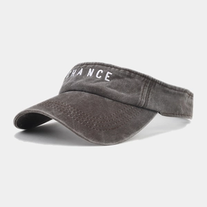 Detail of grey washed cotton visor cap featuring white CHANCE letter embroidery