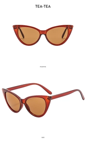 Macro detail of vintage red cat-eye sunglasses with tea lenses from front and side views