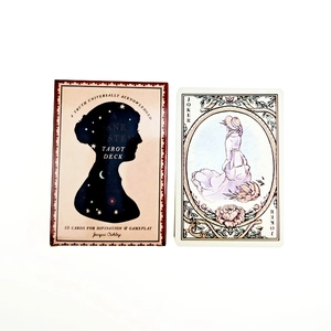 Macro shot of Jane Austen tarot deck packaging and a Joker card on white background