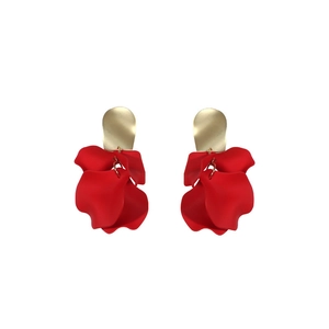Elegant gold and red floral drop earrings with layered petals on white background