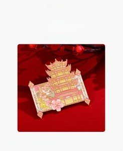 Detail of metal Wuhan Yellow Crane Tower magnet with enamel finish and floral motifs