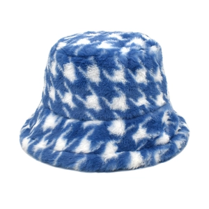 Close-up of blue and white houndstooth pattern plush bucket hat with soft faux fur texture