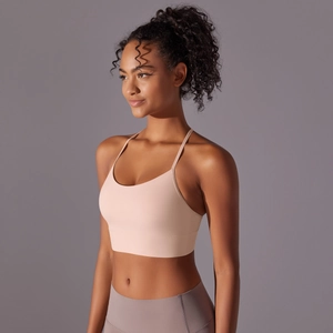 Close-up of racerback sports bra with cross-strap detail and brushed fabric texture