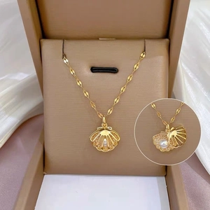 Gold plated shell pearl necklace with micro-pave crystals in a premium jewelry box