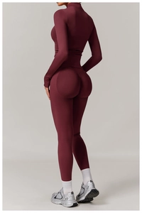 Close-up of seamless burgundy yoga set featuring scrunch butt detailing and high waist
