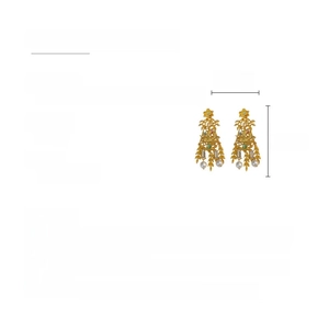 Detailed view of vintage gold earrings with resin flower, rhinestones and faux pearls