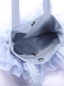 Top view of light blue mesh bag featuring inner zipper pocket and magnetic snap closure