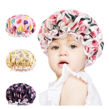 Detail of adjustable elastic band on various patterned waterproof baby shower caps