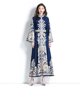 Detail of vintage flare sleeves with delicate hollow lace trim on a navy printed dress