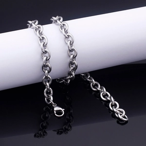 Detailed view of polished silver stainless steel O-chain with lobster clasp on white stand