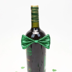 Close-up of a green sequined bow tie decoration for St. Patrick's Day wine bottles