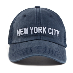 Vintage washed navy blue baseball cap with white New York City embroidery and mesh side panels