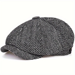 Classic British style black and white herringbone newsboy cap for women in a side view