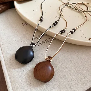 Retro ethnic style wooden pendant necklace with wax rope and polished wooden beads