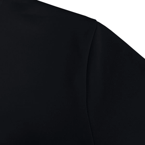 Macro shot of high-density black knit fabric and reinforced seams for durability