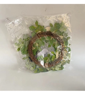 Detail of blue and white striped ribbon on a natural wicker wreath in clear packaging