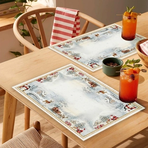 Detailed Christmas placemat with snowman and deer motifs on a warm festive dining table
