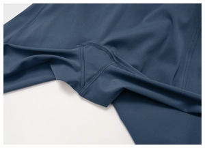 Macro detail of high-quality gusset seams and durable stitching on deep blue yoga pants
