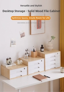 Modern wooden desktop storage drawers of varying heights on a white office desk