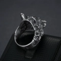 Detailed macro view of vintage stainless steel wolf head ring with embossed texture