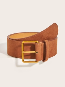 Detail of vintage brown suede wide belt with a brushed gold square metal buckle