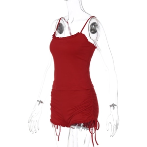 Detail view of red slim fit two-piece set with drawstring shorts and ribbed texture