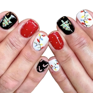 Short Christmas press-on nails with festive tree, string light and polka dot patterns