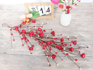 Macro detail of artificial heart berries on decorative twigs for Valentine's Day decor
