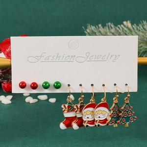 Christmas earring set featuring Santa, snowmen, and trees on a festive background