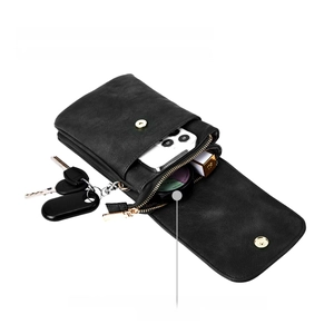 Detail of black leather crossbody phone bag showing multiple internal compartments and capacity