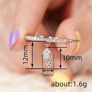 Feather wing pendant ring with inlaid zircon stones in a delicate silver finish