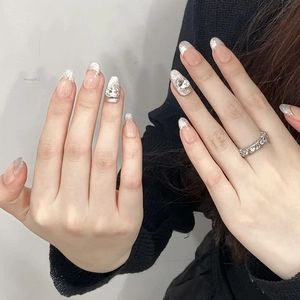 Silver cat eye press-on nails with glitter gradient and heart diamond accents