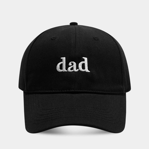 Close-up of dad embroidery on a black cotton baseball cap with a structured crown