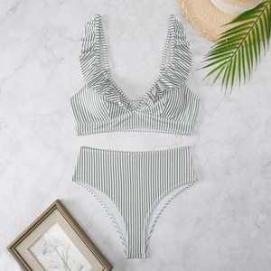 Flat lay of green striped bikini with ruffle deep V-neck and high waisted bottom