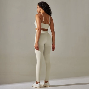 Detail view of seamless high-waist leggings with breathable mesh panels in light beige