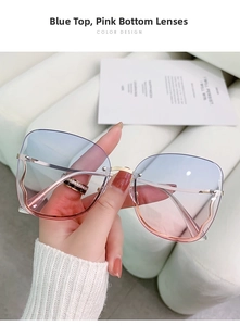 Detail of rimless butterfly sunglasses with blue and pink gradient lenses and wavy metal temples
