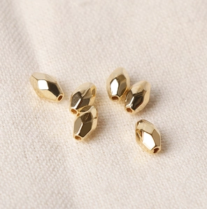 Macro shot of gold CCB diamond faceted spacer beads for DIY jewelry and bracelets
