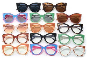 Flat lay display of colorful cat-eye frames in various shades like green, pink, and tortoise