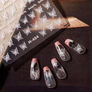 5D embossed white butterfly nail stickers with delicate relief on french tip nails