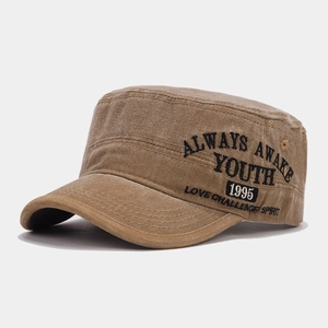 Detail of khaki cadet cap showing vintage washed canvas texture and side embroidery