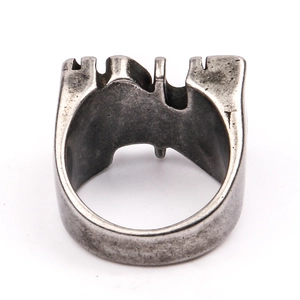Macro detail of vintage silver men's signet ring with distressed industrial texture